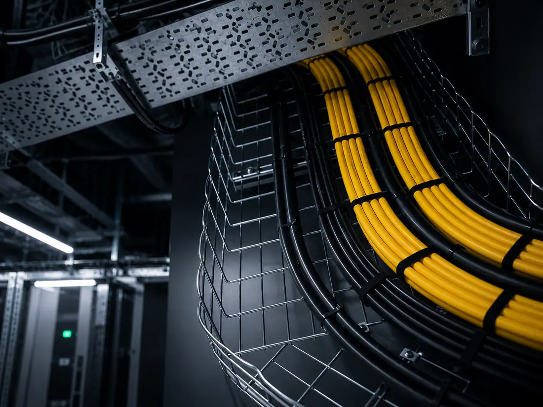 Overhead containment, ladder racks and cable trays inside a data hall
